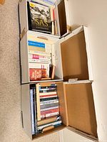 Three boxes showing quantity and variety of books