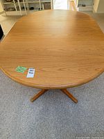 Top view of oval wood dining table showing surface and grain