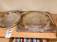 Round and rectangular trays on shelf showing overall style and finish