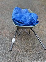 Wheelbarrow front view with blue tarp inside