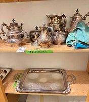 Full set on shelves: teapot, coffee pot, sugar bowl, creamer, covered dish, tray