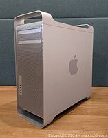 Apple Mac Pro aluminum tower showing side panel, handles, front grille
