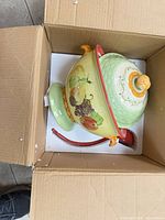 Tureen with lid and ladle inside box