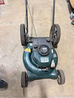 Top view of Craftsman push mower showing engine label and deck