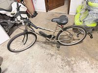 Left side view of Free Spirit 26" mountain bike showing full frame, wheels, and saddle