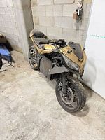 Front left view showing missing fairings and overall condition