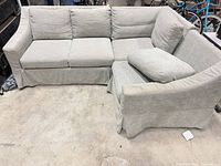 Full view of L-shaped sectional sofa showing overall form and color