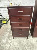 Front view of dark espresso 5-drawer dresser with metal pulls