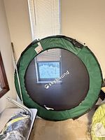 Full view of assembled trampoline ring with jump mat and padding