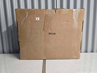 Sealed cardboard box containing the VIVO under-desk laptop tray