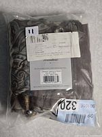 Front view of packaged Madison Park Aubrey valance showing fabric pattern and sealed condition