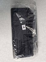 Packaged black napkins showing color and packaging