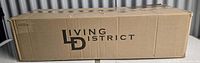 Closed shipping box marked Living District