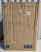 Sealed corrugated shipping box containing the Quoizel Nicholas light