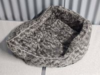Top view of gray plush oval pet bed