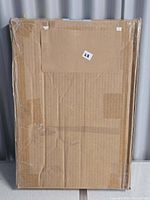 Sealed cardboard-wrapped Wild Indigo II canvas print package