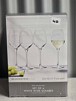 Front of retail box showing the four glasses