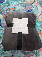Front view of folded Hudson's Bay supermink blanket in original packaging