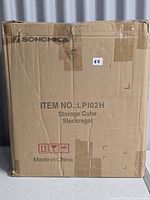 Sealed cardboard box labeled Songmics LP102H