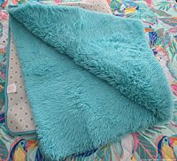 full view rug folded to show pile and backing