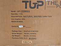 Close-up of carton showing item number, description, dimensions, weight, origin