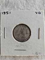 Front of 1951 Canadian silver dime in holder showing reverse Bluenose schooner design