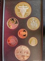 front view of the 7 proof coins in holder