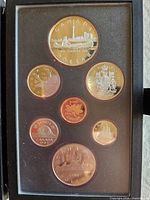 Obverse view of all seven proof coins in original holder