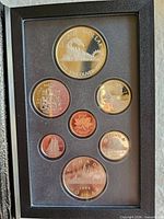 Open case showing seven proof coins