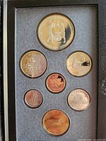 Obverse views of 1988 proof coins in display case