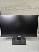 Front view of Asus VA24E monitor on stand