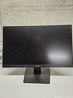 Front view of Asus VA24EHEY monitor on stand