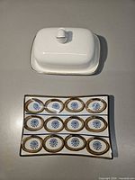 Butter dish with lid and decorative plate side by side