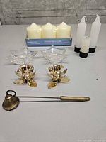 Group shot of snuffer, four holders and candles