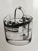 Stock photo of assembled Your Pet, My Care water fountain printed on box
