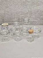Group shot of all visible glass canisters and jar