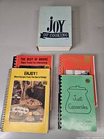 All seven cookbooks laid out