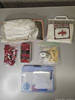 Overview of all cross-stitch supplies laid out on table