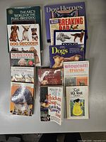 All 11 dog and cat books laid out on table