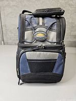 Front view of blue and black California Innovations insulated lunch bag