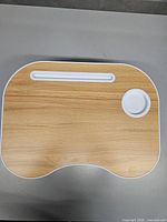 top view showing wood-grain surface, groove and cup holder