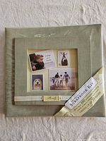 Front view of sealed green scrapbook kit