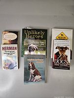 All seven books arranged in three columns