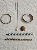 All six jewellery pieces laid out