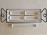 Rack with large tray and four small trays displayed
