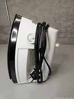 Side view of Proctor Silex iron with cord wrapped