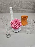 Group shot of all six vases and artificial flower