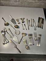 All flatware and servers spread on table for item count and overview