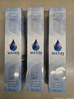 Front view of three sealed WATEN H2O filter boxes