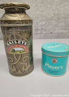 Both tins side by side, showing relative sizes and branding